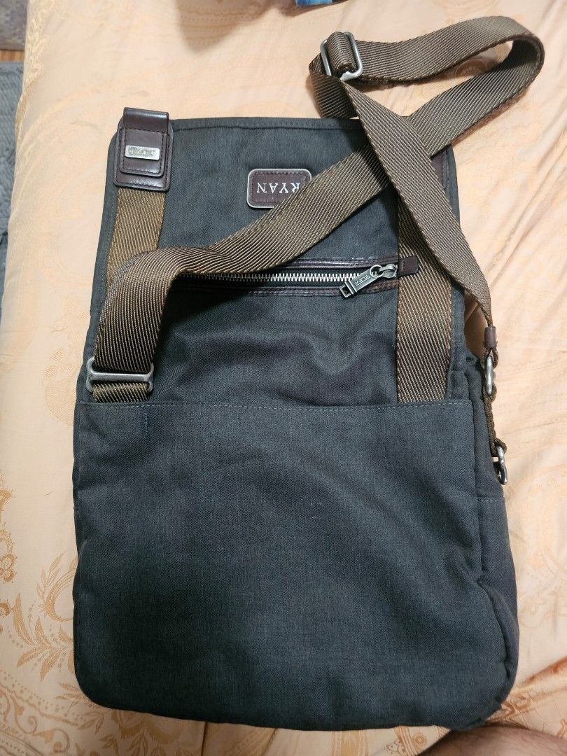 Tumi Crossbody Messenger Bag Dark Grey (Category: Sling Bags) located in Quezon City. Submitted by ryanstuff.ph (Listing ID 1469580569, Image 3). Description: - Brand: Tumi with engraving but can easily be change sa tumi store - Color: Dark grey canvas with brown leather accents and strap - Closure: Flap cover with secure magnetic closure - Hardware: Metal zippers with signature Tumi pulls - Interior: Stylish hexagonal pattern lining with spaciou