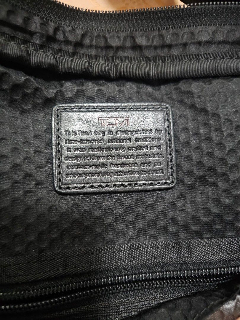 TUMI TSW Black Nylon shoulder Bag with Shoulder Strap (Category: Briefcases) located in Quezon City. Submitted by ryanstuff.ph (Listing ID 1469580413, Image 2). Description: - Material: Durable black ballistic nylon - Compartments: Generous main compartment for daily work essentials and exterior zipped pocket - Carrying Options: Sturdy top handle and adjustable shoulder strap with clips - Hardware: Solid hardware details with secure zip closures 