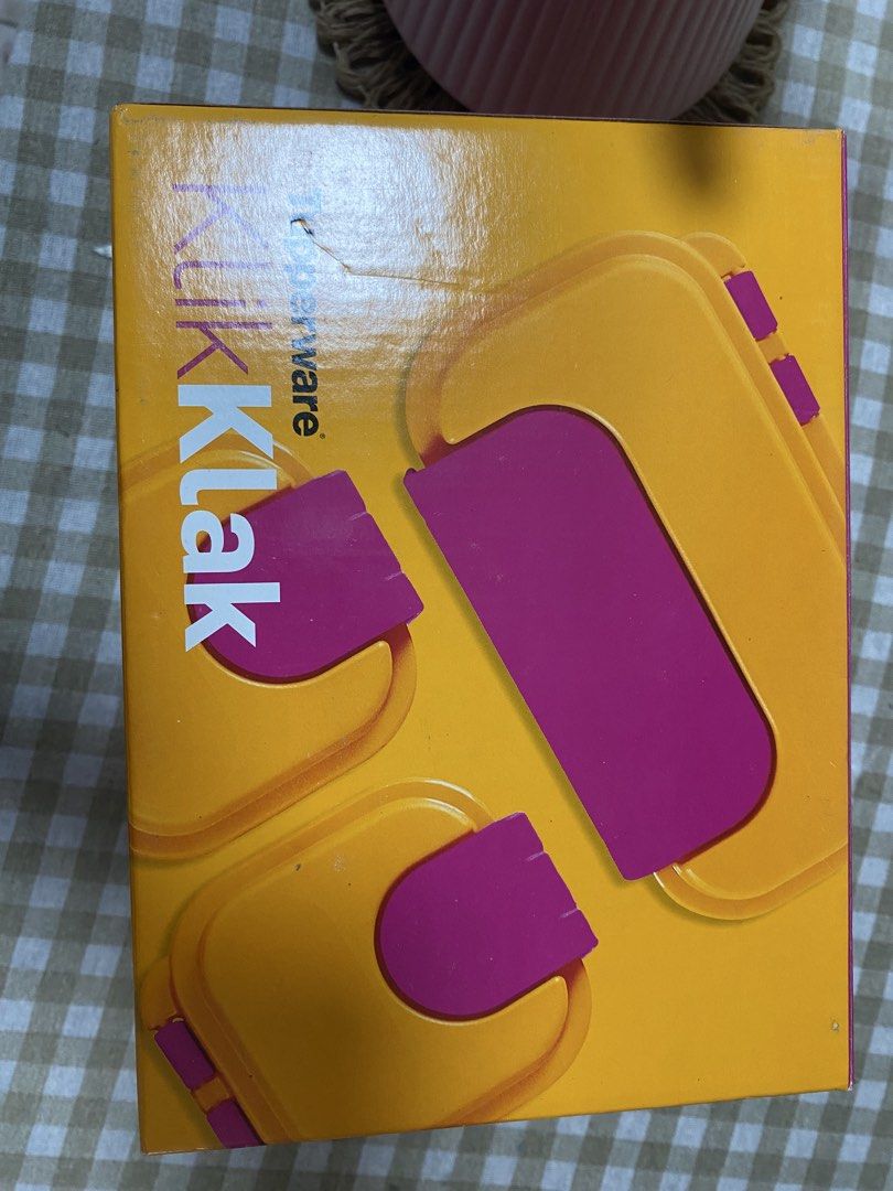 Tupperware KlikKlak Lunch Box Set-4 pcs (Category: Food Organization & Storage) located in Cavite. Submitted by yc.shoppemnl (Listing ID 1469577761, Image 2). Description: - Authentic Tupperware KlikKlak food storage set - Colors: Vibrant yellow and pink - Brand new, never used, and individually wrapped in original retail box - 1x large compartment container with a divider - 1x medium container - 2x small snack boxes - Ideal for meal prep, office