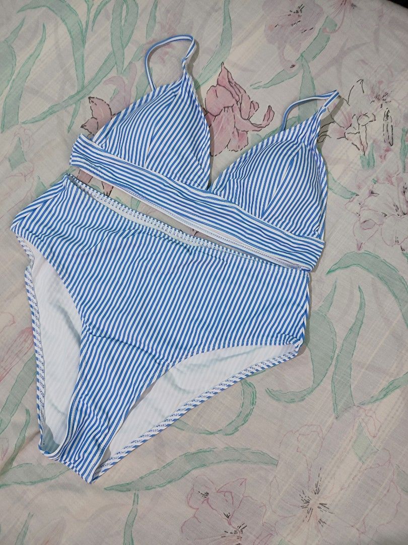Two-piece bikini set with green halter top and patterned shorts (Category: Bikinis & Swimsuits) located in Noveleta. Submitted by preloved__items___ (Listing ID 1469618694, Image 2). Description: - Green halter neck top with adjustable tie strings - Matching high-waisted shorts with botanical orange and white floral print - Comfortable elastic waistband for easy wear - Vibrant colors designed to stand out under the sun - Ideal for beach trips, po