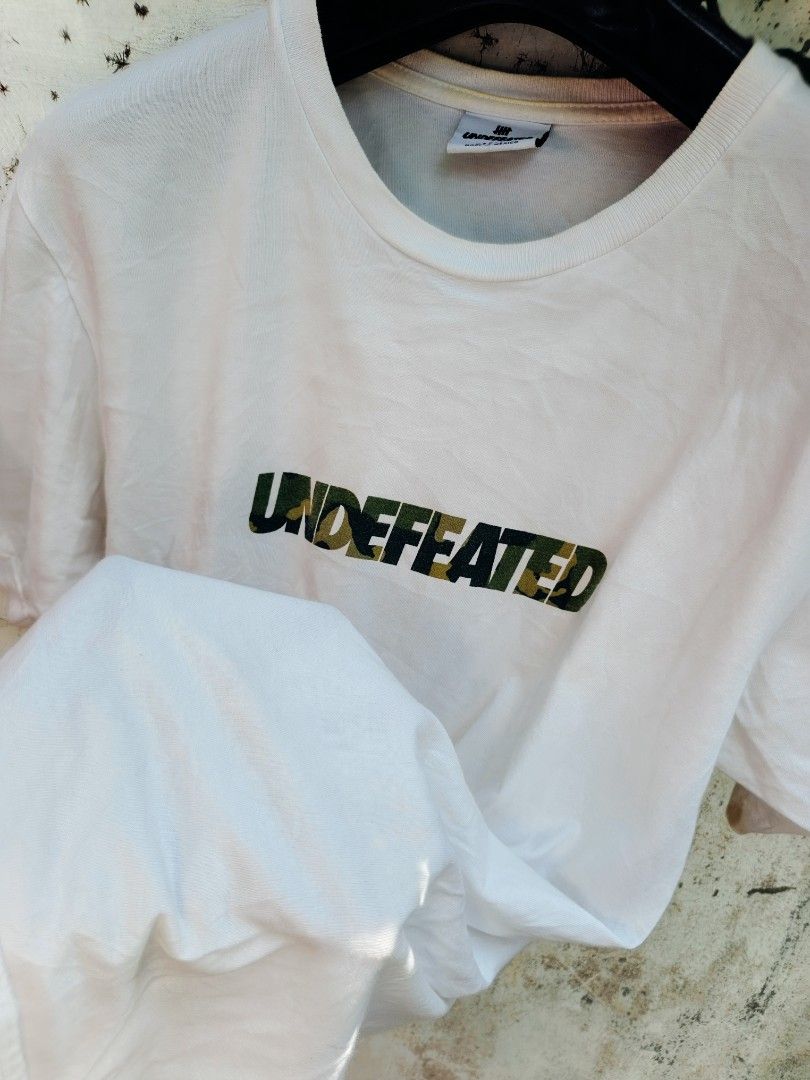 Undefeated shirt (Category: Luxury Apparel) located in Tacurong. Submitted by lyjetbrandedfinds_1827 (Listing ID 1469602870, Image 2). Description: Medium konsiderasyon stitch.