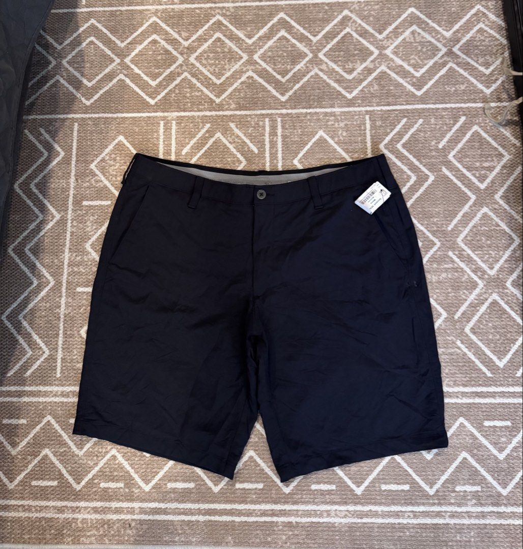 Under Armour Black Golf Shorts Size 40 (Category: Shorts) located in Bulacan. Submitted by zyannechlo86360 (Listing ID 1469643020, Image 1). Description: - Brand: Under Armour - Condition: Brand new with original retail tags attached - Color: Solid black - Size: Waist 40 - Waistband: Elastic grip design to keep your shirt securely tucked in during swings - Closure: Button closure with zip fly - Pockets: Front hand pockets and back welt pockets wi