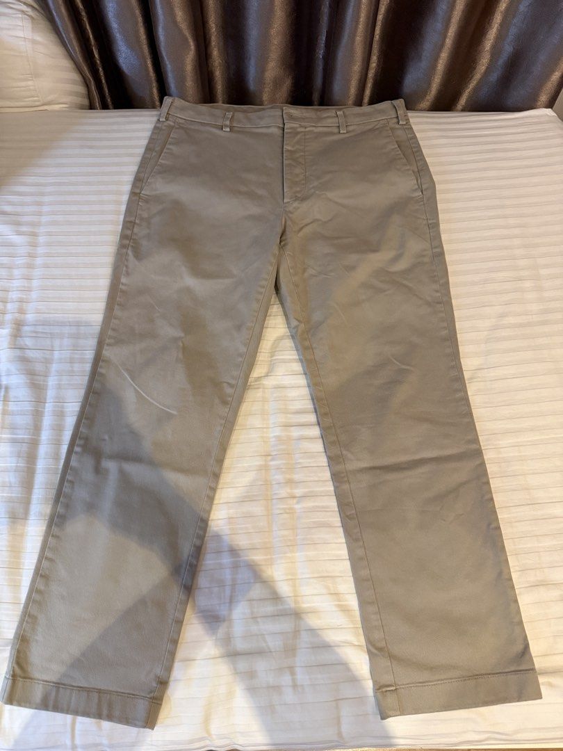 Uniqlo Grey Chino Pants (Category: Chinos) located in Muntinlupa City. Submitted by golf823 (Listing ID 1469684401, Image 1). Description: - Brand: Uniqlo - Color: Khaki grey - Size: 79cm waist - Material: 97% cotton, 3% spandex (with stretch for comfort) - Features: Zip fly, back button pockets - Condition/Fit: Measurements available in photos.