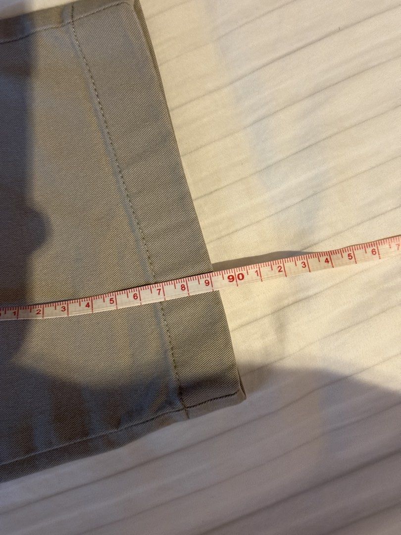 Uniqlo Grey Chino Pants (Category: Chinos) located in Muntinlupa City. Submitted by golf823 (Listing ID 1469684401, Image 3). Description: - Brand: Uniqlo - Color: Khaki grey - Size: 79cm waist - Material: 97% cotton, 3% spandex (with stretch for comfort) - Features: Zip fly, back button pockets - Condition/Fit: Measurements available in photos.