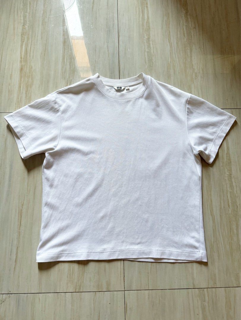 Uniqlo White Tshirt (Category: Tshirts & Polo Shirts ) located in Mandaluyong City. Submitted by rxstudio (Listing ID 1469619690, Image 1). Description: Uniqlo White Tshirt | Unisex Size: L Dimes: 25 x 21 Condition: No Issue ₱400 + SF Pick-up/Meet-up: Mandaluyong, Highway Hills (recommended to avoid scams) Delivery: Available via Lalamove (Shipping fee to be shouldered by the buyer).
