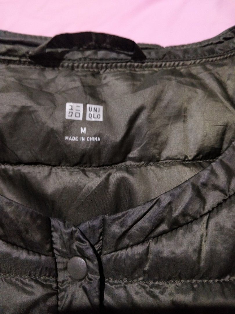 Uniqlo Ultra Light Down Jacket Green Size M (Category: Coats, Jackets and Outerwear) located in Marikina City. Submitted by rusellej (Listing ID 1469706912, Image 3). Description: - Brand: Uniqlo - Item: Ultra Light Down Jacket - Color: Green - Size: Medium (M tag on collar) - Closure: Snap button front with round neckline - Design: Quilted puffer with long sleeves - Features: Lightweight, highly packable, great for travel and chilly weather - Or