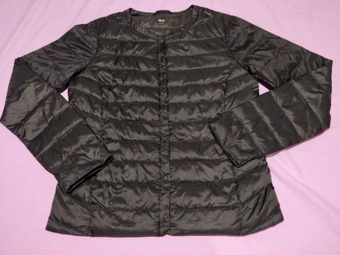 Uniqlo Ultra Light Down Jacket Green Size M (Category: Coats, Jackets and Outerwear) located in Marikina City. Submitted by rusellej (Listing ID 1469706912, Image 2). Description: - Brand: Uniqlo - Item: Ultra Light Down Jacket - Color: Green - Size: Medium (M tag on collar) - Closure: Snap button front with round neckline - Design: Quilted puffer with long sleeves - Features: Lightweight, highly packable, great for travel and chilly weather - Or