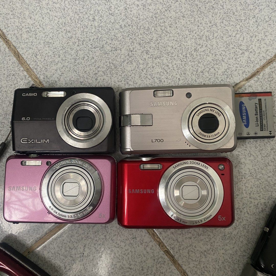 UNTESTED DIGICAMS (Category: Cameras) located in Tarlac. Submitted by jelugh (Listing ID 1469521183, Image 1). Description: 350 each UNTESTED — 350 each 📸 * samsung es80 (pink) - 350 * samsung es90 (red) — SOLD * samsung es65 (red) - 350 * samsung pl20 (pink) — SOLD — medj loose batt door when opening. doesn’t open on its own and still intact * samsung L700 - 500📸 (with batt lobo) * casio exilim s880 - 350 (no batt door, may lock) do note that 