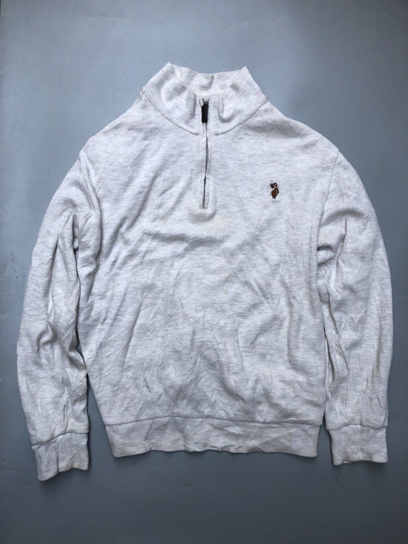 U.S. Polo Assn. Quarter-Zip Pullover Sweater Grey (Category: Coats, Jackets and Outerwear) located in Manila. Submitted by thriftedluxgarments (Listing ID 1469659243, Image 1). Description: - Brand: U.S. Polo Assn. - Style: Quarter-zip sweater / Mock neck with brown leather pull - Color: Heather Grey - Size: Medium - Details: Embroidered horse logo on chest, ribbed cuffs and hem - Material: Comfortable cotton blend fabric, perfect for everyday la