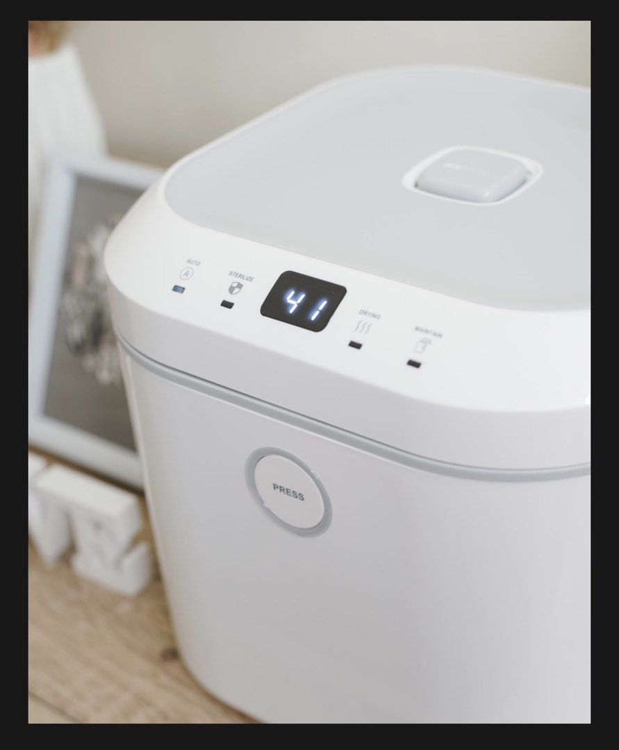 UV Care Multipurpose Sterilizer (Category: Breastfeeding & Bottle Feeding) located in Pasig City. Submitted by revieconde (Listing ID 1469755415, Image 1). Description: - Brand: UV Care - Color: White and Grey - Condition: Clean and well-maintained - Features: Digital top display, front push-button, and upward-hinged lid with wire rack and UV lamp - Modes: Auto, Sterilize, Drying, and Maintain - Best For: Baby bottles and various household items.