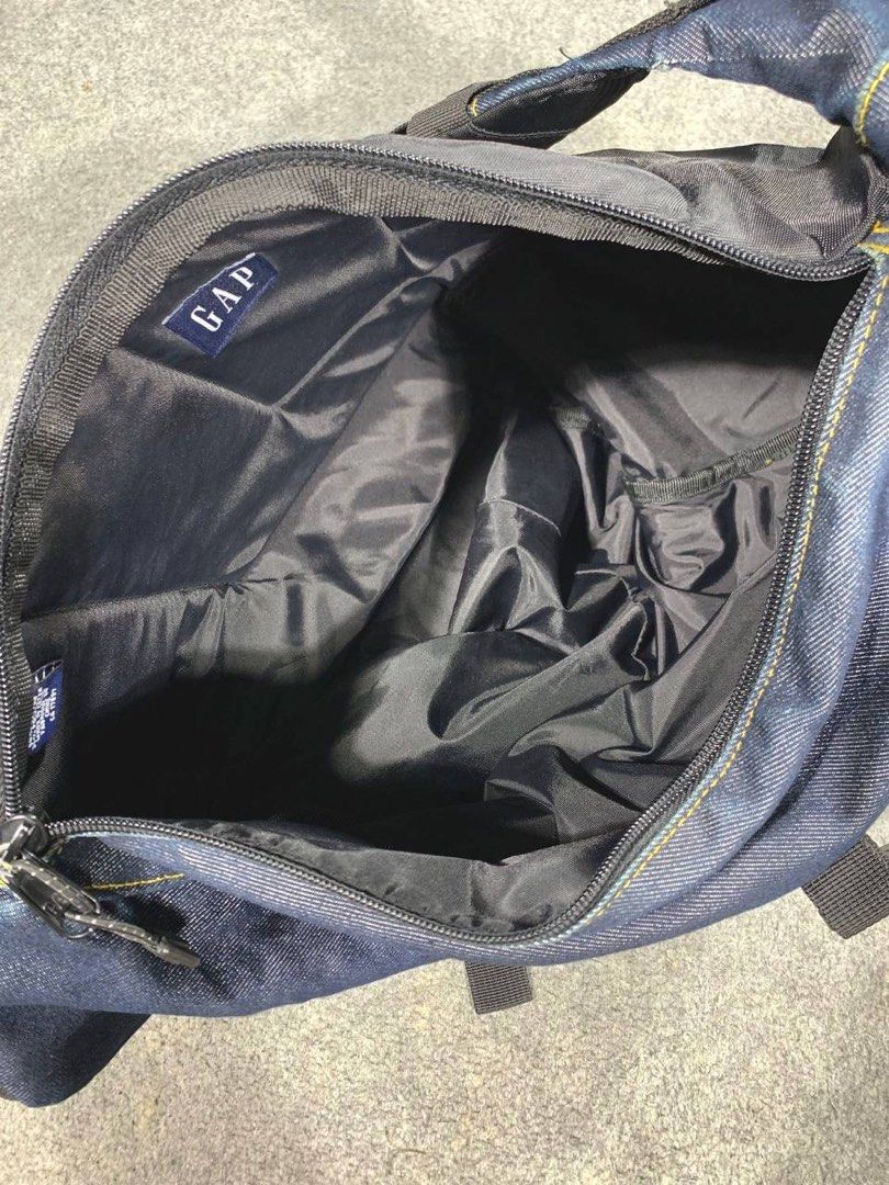 V1NTAGE GAP TECHNICAL Deep Indigo Denim Utility Sling Bag (Category: Sling Bags) located in Zamboanga. Submitted by zhifay (Listing ID 1469731926, Image 3). Description: V1NTAGE GAP TECHNICAL Deep Indigo Denim Utility Sling Bag 00s vintage "Old Gap" technical denim utility sling backpack in a rich indigo colorway. Features a heavy-duty structured denim build, signature yellow contrast stitching, a geometric padded back panel, an integrated strap 