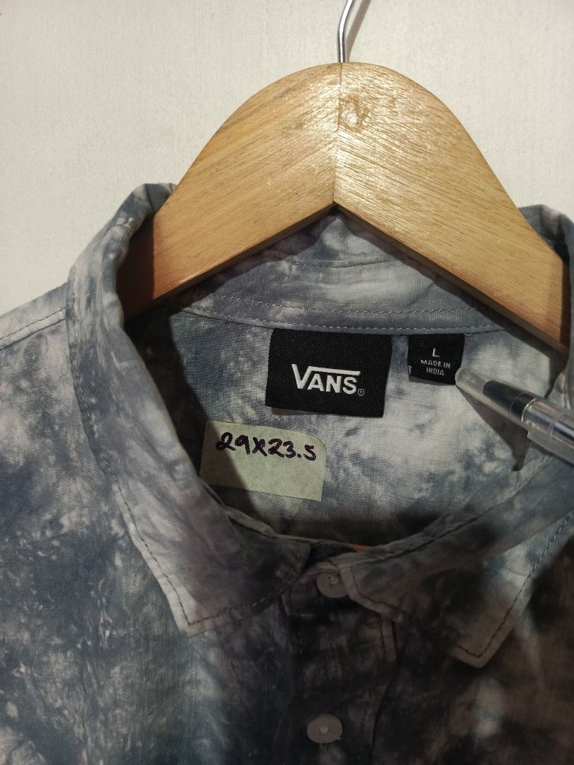 VANS TIE DYE SHIRT (Category: Tshirts & Polo Shirts ) located in Baguio. Submitted by 074thriftmania (Listing ID 1469693195, Image 3). Description: Vans short sleeve button-down shirt in a grey and white tie-dye wash. Size L, made in India. Standard collar with front button closure. Chest pocket with small Vans tag on the left side. Embroidered peace sign and Vans logo on the upper back right shoulder. Curved hemline. Lightweight material, great 
