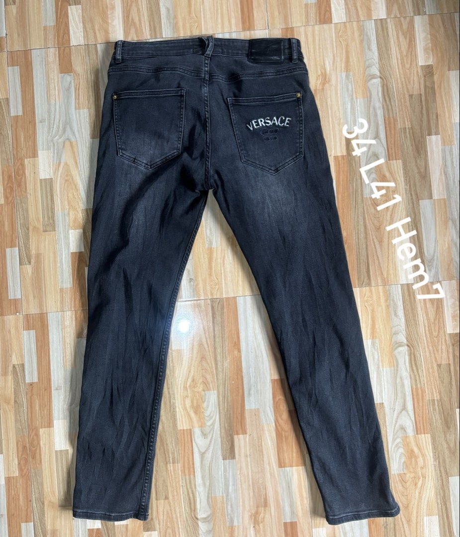 Versace Black Denim Jeans Size 34 (Category: Jeans) located in Tubigon. Submitted by wawiesunbe75372 (Listing ID 1469640056, Image 2). Description: - Brand: Versace - Size: 34 - Color: Washed black - Fit: Regular fit denim - Details: Embroidered Versace branding on the back pocket, branded hardware, button closure, and leather logo patch at the back waistband - Origin: Made in Italy - Condition: Excellent / Ready to wear.