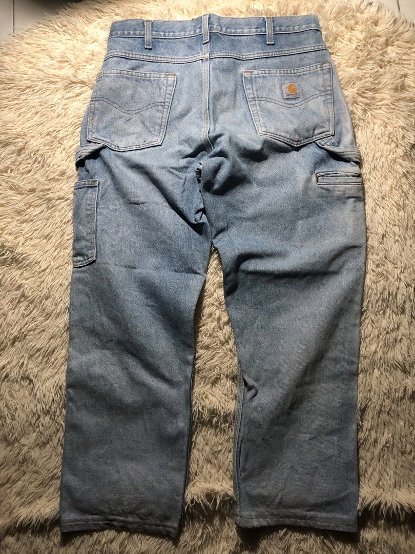 Vintage Carhartt Double Loop Workwear Condi Carpenter Pants (Category: Jeans) located in Maria Aurora. Submitted by kylerikathriftshop101010 (Listing ID 1469715008, Image 1). Description: 33-34 38 length 8 hem altered, paint stain,repairs, changed patch kase nasira na kase dati syang leather patch - Brand: Carhartt - Style: Vintage light wash denim work pants with carpenter pockets and hammer loop - Closure: Button fly with sturdy belt loops - De