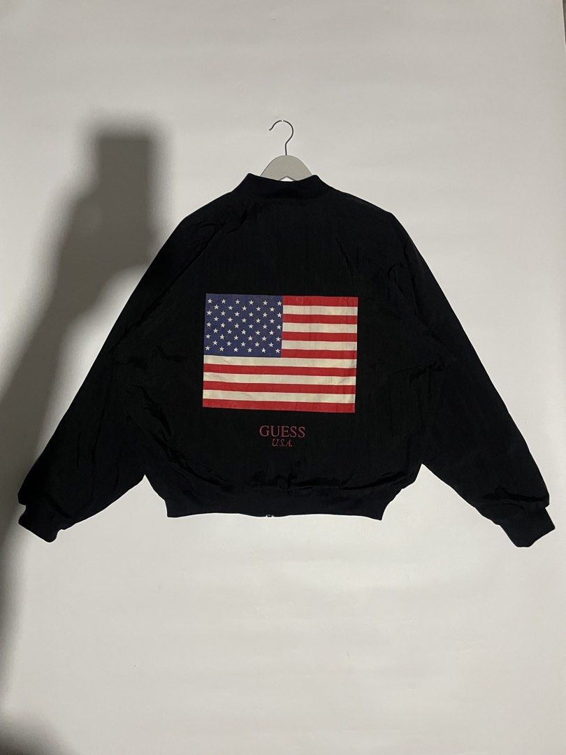 Vintage guess American flag bomber jacket (Category: Coats, Jackets and Outerwear) located in Bais. Submitted by christian.complexthrift08 (Listing ID 1469743347, Image 1). Description: Vintage Guess “American flag” bomber jacket (Massive American flag at the back) Color: black Size: XL boxy fit Width: 26.5 inches Length: 26.5 inches Condition: 9 / 10 Issue: -barely noticeable stain in the inside liner -print issue at the back but it is still ver