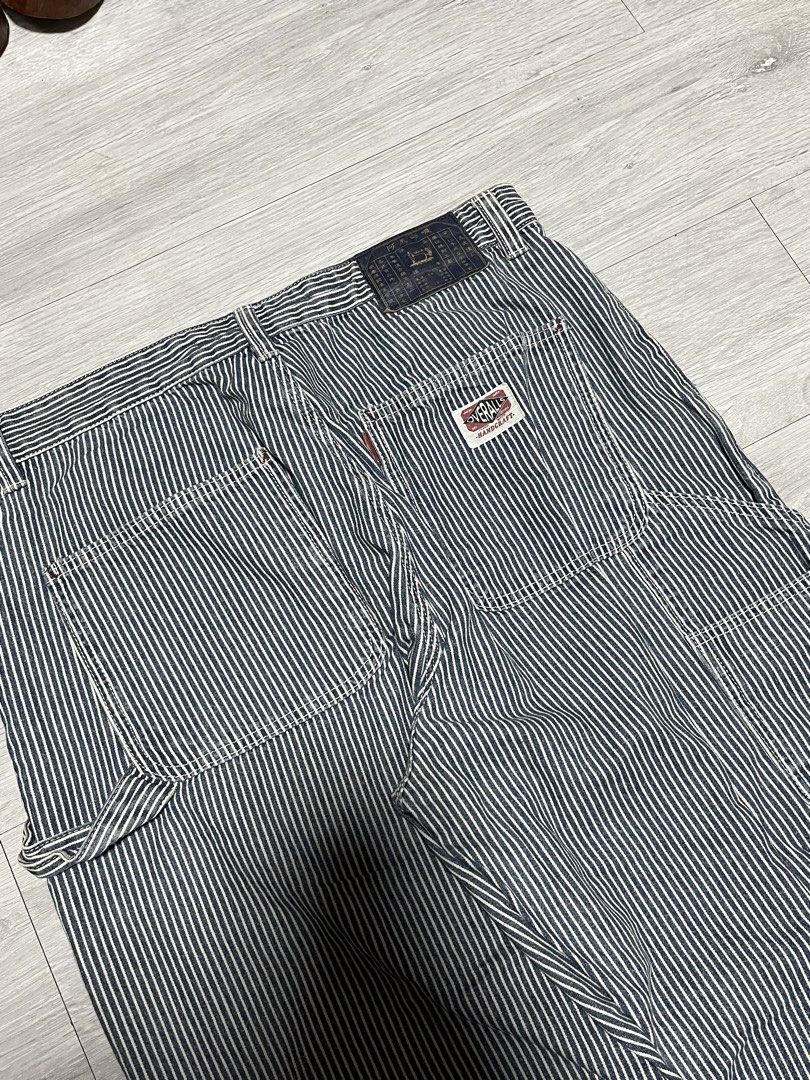 Vintage Hickory Stripe Carpenter Overalls Pants (Category: Jeans) located in Manila. Submitted by jorgemabelin2001 (Listing ID 1469605243, Image 3). Description: - Classic blue and white hickory stripe design - Heavy-duty utility style with multiple patch pockets - Functional side hammer loop and button fly - Detailed with a back pocket woven patch and vintage waistband label - Sturdy workwear construction with contrast white stitching - Conditio