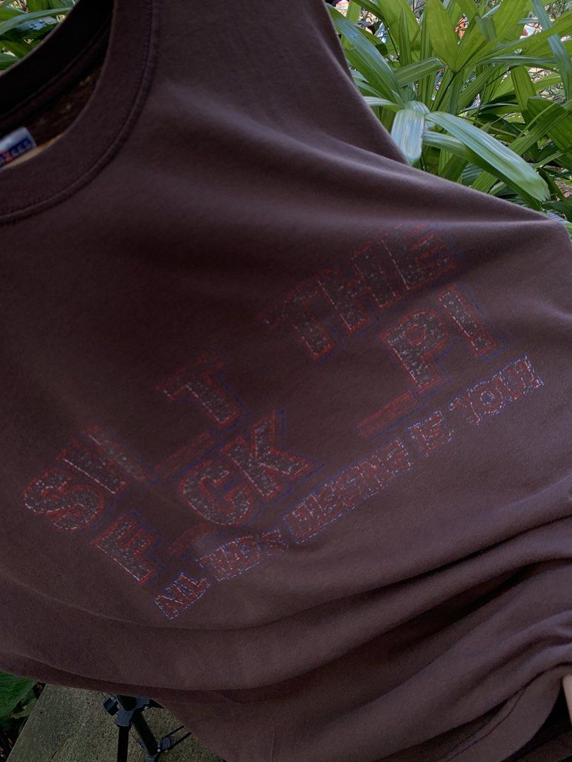 Vintage late 1990s/Y2K STFU parody statement tee (Category: Tshirts & Polo Shirts ) located in Cagayan de Oro. Submitted by premium_thrifts (Listing ID 1469586564, Image 3). Description: Brown colorway. Used condition. Double stitch on both sleeves and hem Fits Large L29" x W22" 20" (shoulder to shoulder) 7.5" (sleeve length) Issue: faded print, and crackprint Add shipping fee (via JRS or J&T).