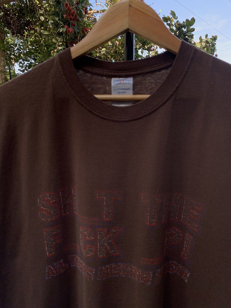 Vintage late 1990s/Y2K STFU parody statement tee (Category: Tshirts & Polo Shirts ) located in Cagayan de Oro. Submitted by premium_thrifts (Listing ID 1469586564, Image 1). Description: Brown colorway. Used condition. Double stitch on both sleeves and hem Fits Large L29" x W22" 20" (shoulder to shoulder) 7.5" (sleeve length) Issue: faded print, and crackprint Add shipping fee (via JRS or J&T).