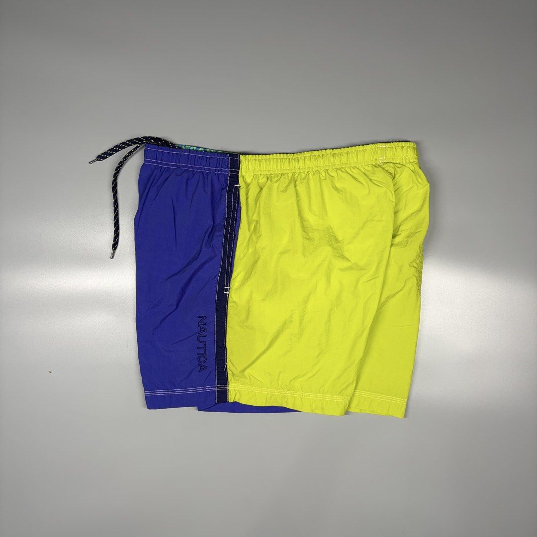 Vintage Nautica With Inner Mesh (Category: Activewear) located in Cavite. Submitted by onebeancent (Listing ID 1469719830, Image 1). Description: Size: Large (34 to 40 Waistline) Dimension: 16" Length (Above the knee) Color: Blue & Lime Color Rate: 10/10 Issue: None Condition: Like new‼️ Price: 780php Additional Shipping Fee (J&T Small Pouch) 75php Luzon 100php visayas 120php mindanao.