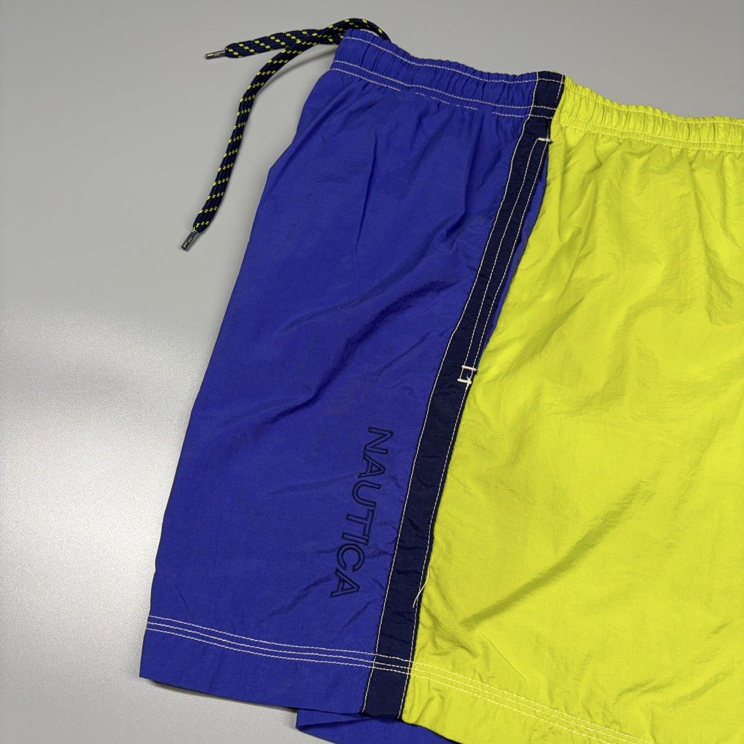 Vintage Nautica With Inner Mesh (Category: Activewear) located in Cavite. Submitted by onebeancent (Listing ID 1469719830, Image 3). Description: Size: Large (34 to 40 Waistline) Dimension: 16" Length (Above the knee) Color: Blue & Lime Color Rate: 10/10 Issue: None Condition: Like new‼️ Price: 780php Additional Shipping Fee (J&T Small Pouch) 75php Luzon 100php visayas 120php mindanao.