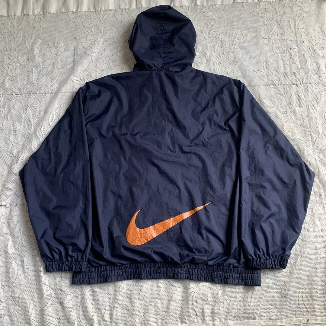 Vintage Nike Navy Blue Orange Windbreaker Jacket (Category: Coats, Jackets and Outerwear) located in Manila. Submitted by xumiiyea (Listing ID 1469583797, Image 2). Description: Nike 1990s vintage retro sportswear windbreaker navy blue size large 100% nylon made in Indonesia Full zip dual front pockets adjustable drawstring hood Excellent vintage condition.