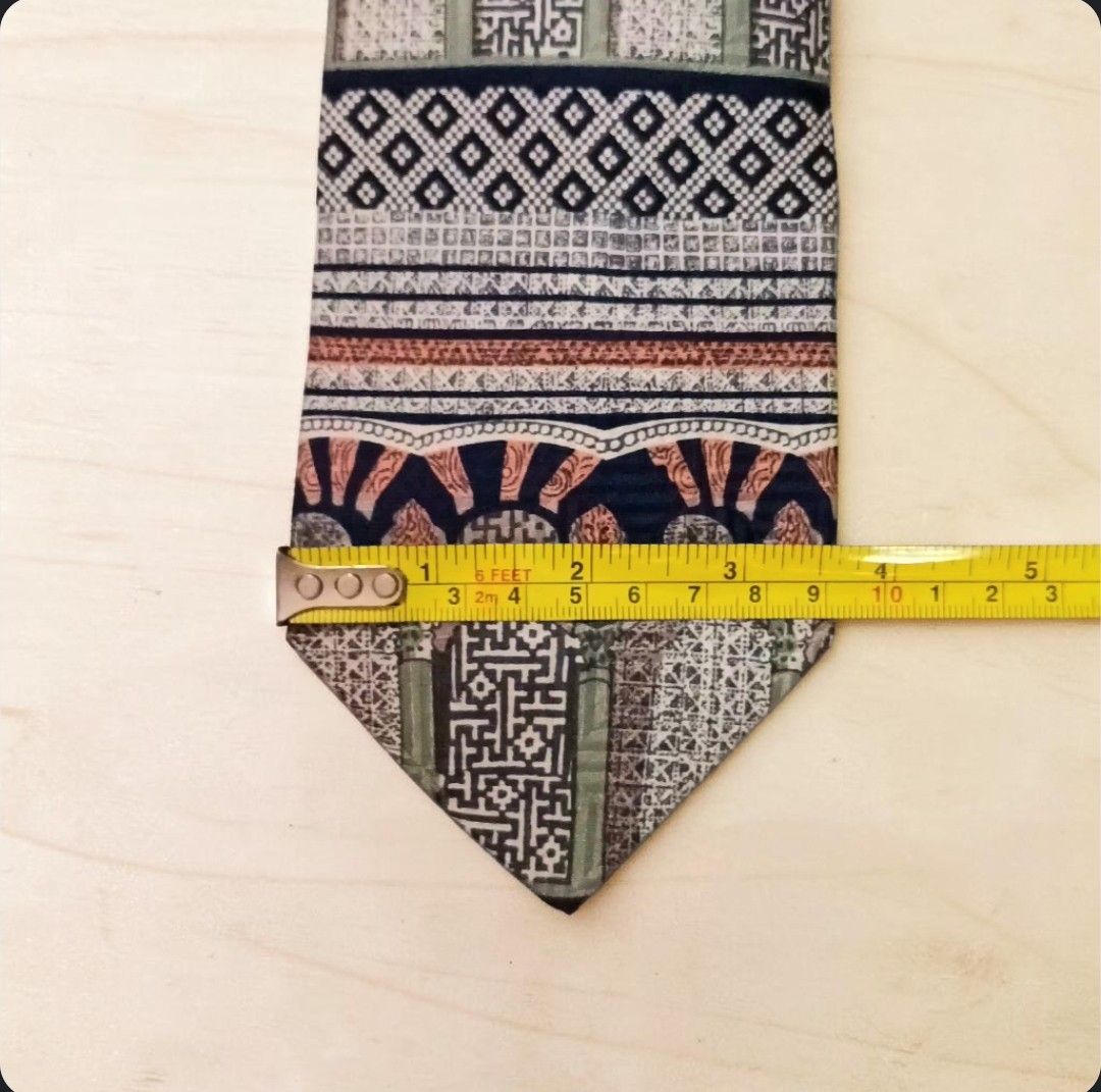 Vintage Oleg Cassini 100% Silk Tie w/ Geometric Pattern (Category: Ties) located in Quezon City. Submitted by happyvintage49 (Listing ID 1469732614, Image 2). Description: 📍Decluttering, NOT ukay - Design: Unique multi-pattern necktie with geometric and traditional motifs - Material: 100% pure silk - Width: Approximately 3.75 inches at the widest point - Color: blue, green, terracotta, and cream color blocking - Style: Great statement piece - Co