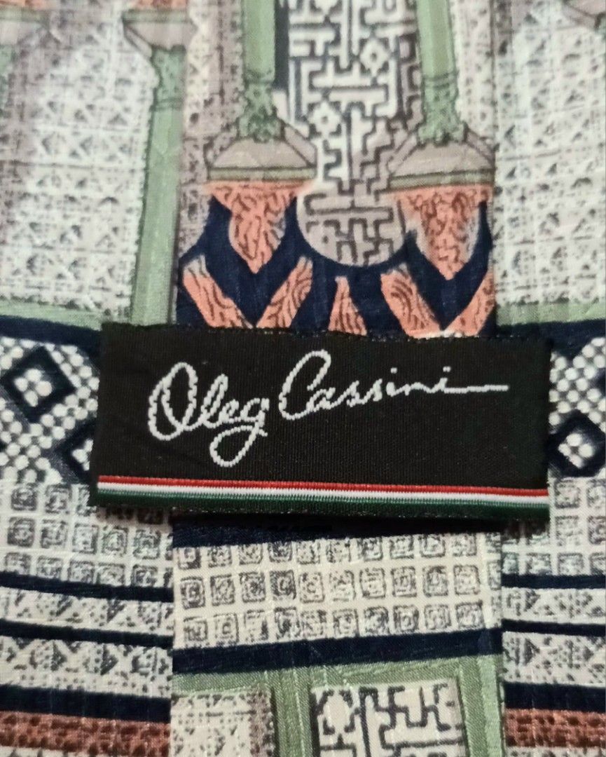 Vintage Oleg Cassini 100% Silk Tie w/ Geometric Pattern (Category: Ties) located in Quezon City. Submitted by happyvintage49 (Listing ID 1469732614, Image 3). Description: 📍Decluttering, NOT ukay - Design: Unique multi-pattern necktie with geometric and traditional motifs - Material: 100% pure silk - Width: Approximately 3.75 inches at the widest point - Color: blue, green, terracotta, and cream color blocking - Style: Great statement piece - Co
