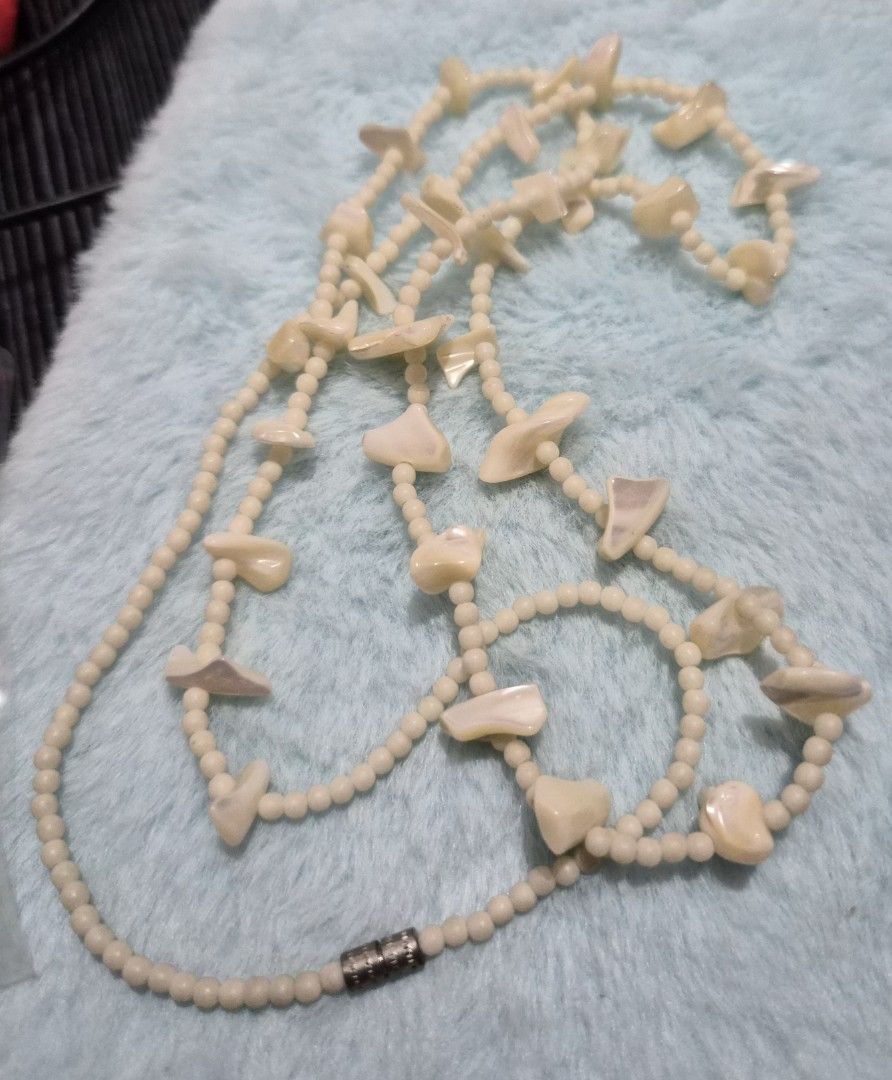 Vintage pearl and shell beaded necklace (Category: Necklaces) located in Mandaue City. Submitted by chuchi152615 (Listing ID 1469687677, Image 3). Description: - Length: Long 35-inch total length, easy to slip over the head - Materials: White pearl-like seed beads with scattered iridescent shell pieces and mother-of-pearl stations - Closure: Secure metallic silver-tone barrel clasp - Comfort: Lightweight design, comfortable for everyday wear - St