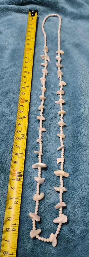 Vintage pearl and shell beaded necklace (Category: Necklaces) located in Mandaue City. Submitted by chuchi152615 (Listing ID 1469687677, Image 2). Description: - Length: Long 35-inch total length, easy to slip over the head - Materials: White pearl-like seed beads with scattered iridescent shell pieces and mother-of-pearl stations - Closure: Secure metallic silver-tone barrel clasp - Comfort: Lightweight design, comfortable for everyday wear - St