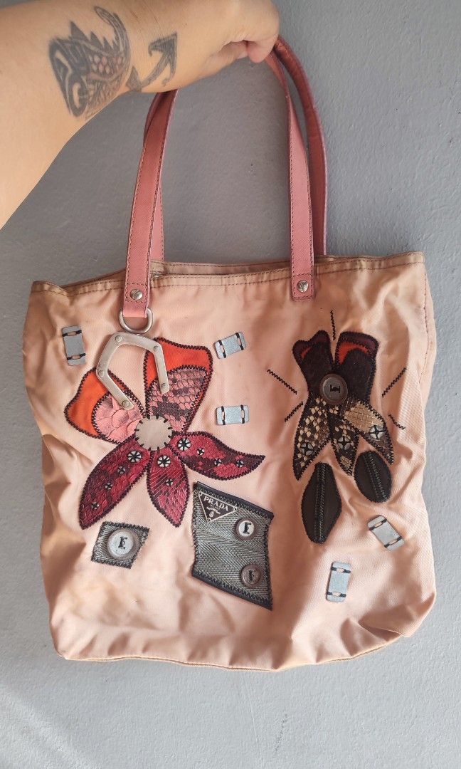 Vintage Prada Tessuto Nylon (Category: Tote Bags) located in Marikina City. Submitted by adzie05 (Listing ID 1469582657, Image 1). Description: Vintage Prada Tessuto Nylon Patchwork Applique Tote Bag Some minor yellow stains.. Really cute in actual! Price is still negotiable for sure buyer..
