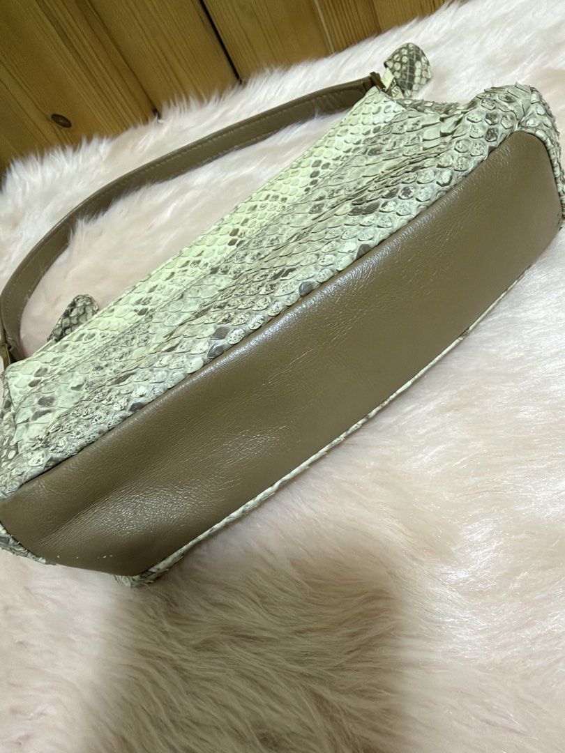Vintage Sage tan Python-Print Shoulder Bag (Category: Shoulder Bags) located in Taguig. Submitted by titanars (Listing ID 1469596515, Image 3). Description: • Style: Y2K Baguette / Shoulder Purse • Details: Features an exotic faux-python scaled texture in light mint/sage green, paired with a solid olive brown leather strap and bottom base. Silver-tone hardware accents. • Condition: Pre-loved in great condition. Clean interior, smooth working zipp