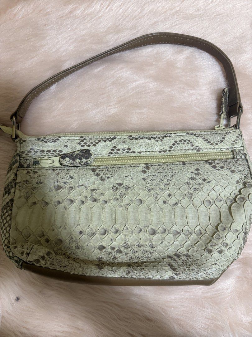 Vintage Sage tan Python-Print Shoulder Bag (Category: Shoulder Bags) located in Taguig. Submitted by titanars (Listing ID 1469596515, Image 2). Description: • Style: Y2K Baguette / Shoulder Purse • Details: Features an exotic faux-python scaled texture in light mint/sage green, paired with a solid olive brown leather strap and bottom base. Silver-tone hardware accents. • Condition: Pre-loved in great condition. Clean interior, smooth working zipp