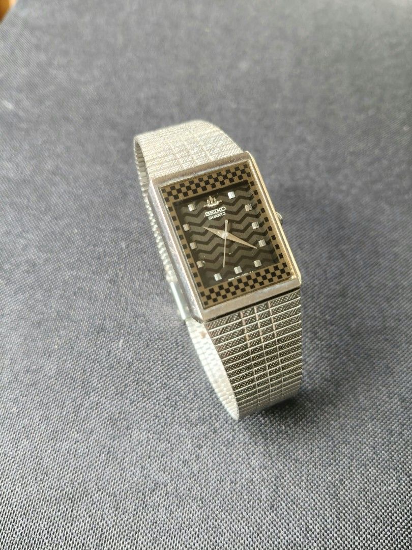 Vintage Seiko Rectangle Watch Textured Dial (Category: Luxury Watches) located in Tagbilaran City. Submitted by mr_chic (Listing ID 1469620894, Image 1). Description: - Brand/Type: Seiko Quartz Analog Watch - Design: Rectangular case with a rare textured geometric dial - Material: Silver-tone base metal with stainless steel back - Strap: Stylish patterned link bracelet - Details: Battery-operated, water-resistant - Condition: Tested and working p