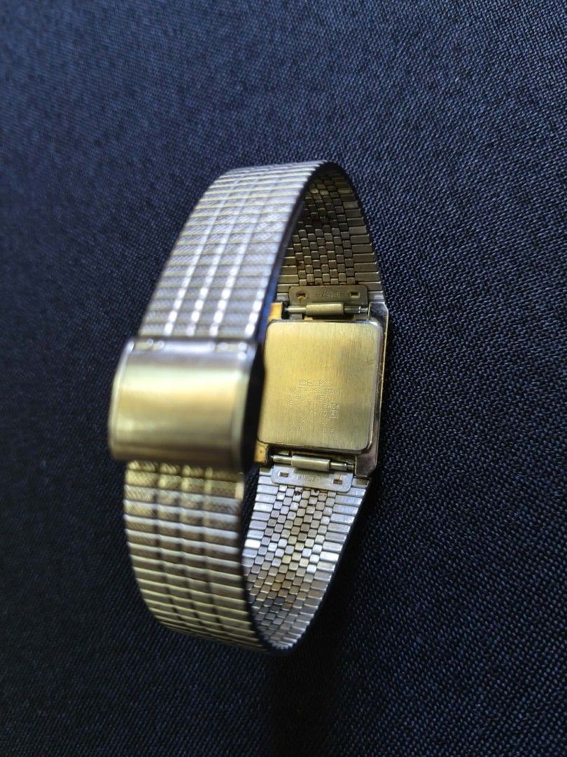 Vintage Seiko Rectangle Watch Textured Dial (Category: Luxury Watches) located in Tagbilaran City. Submitted by mr_chic (Listing ID 1469620894, Image 2). Description: - Brand/Type: Seiko Quartz Analog Watch - Design: Rectangular case with a rare textured geometric dial - Material: Silver-tone base metal with stainless steel back - Strap: Stylish patterned link bracelet - Details: Battery-operated, water-resistant - Condition: Tested and working p