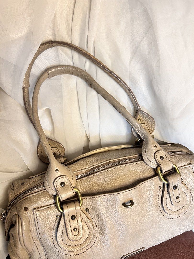 VINTAGE SLOUCHY LEATHER SHOULDER BAG (Category: Shoulder Bags) located in Baguio. Submitted by chmlnstudios (Listing ID 1469664267, Image 2). Description: VINTAGE SLOUCHY LEATHER SHOULDER BAG / BOWLING BAG CODE: C11-B02 A spacious, Y2K-inspired slouchy shoulder bag in a versatile beige / warm nude shade. Crafted from pebbled leather with antique brass hardware accents and Chloe-style padded handle details, making it an effortless daily statement 