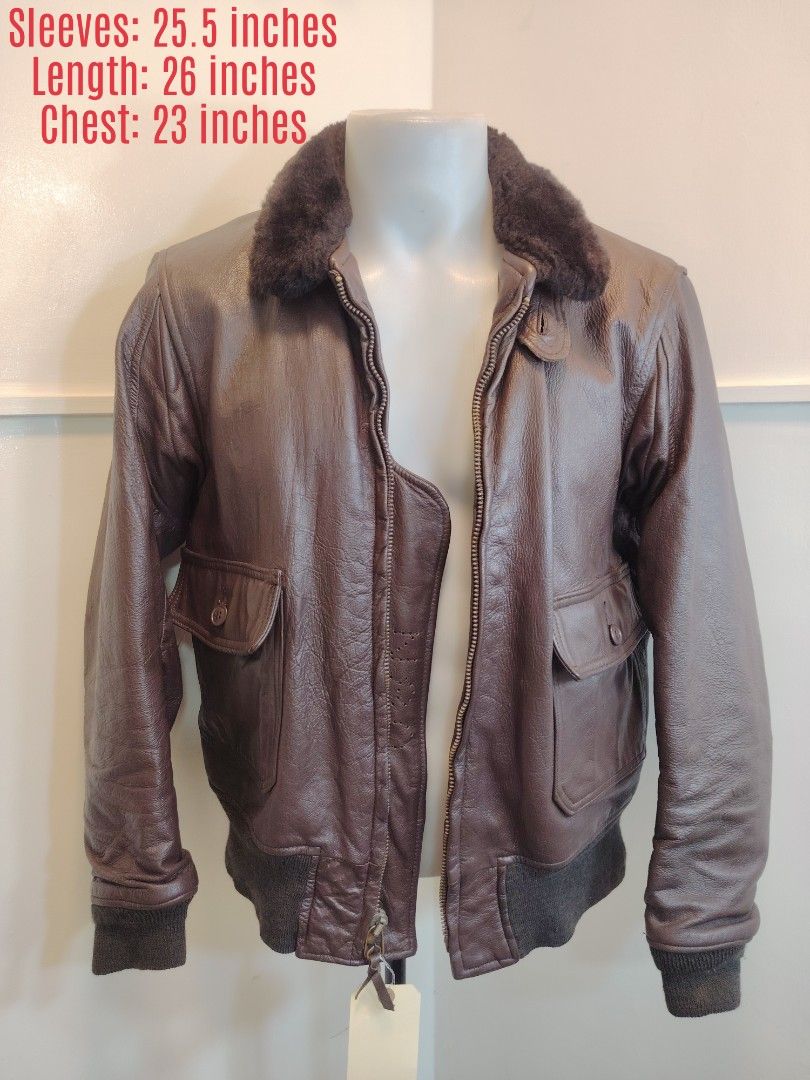 Vintage USN LEATHER JACKET (Category: Coats, Jackets and Outerwear) located in La Trinidad. Submitted by padasem_kadi (Listing ID 1469618784, Image 1). Description: - Style: Classic pilot flight bomber jacket - Color: Brown leather with a dark brown plush fur collar - Features: Front zip closure, dual button-flap waist pockets - Measurements (laid flat): Chest 23 inches, Length 26 inches, Sleeves 25.5 inches - Condition: Excellent buyer-friendly 