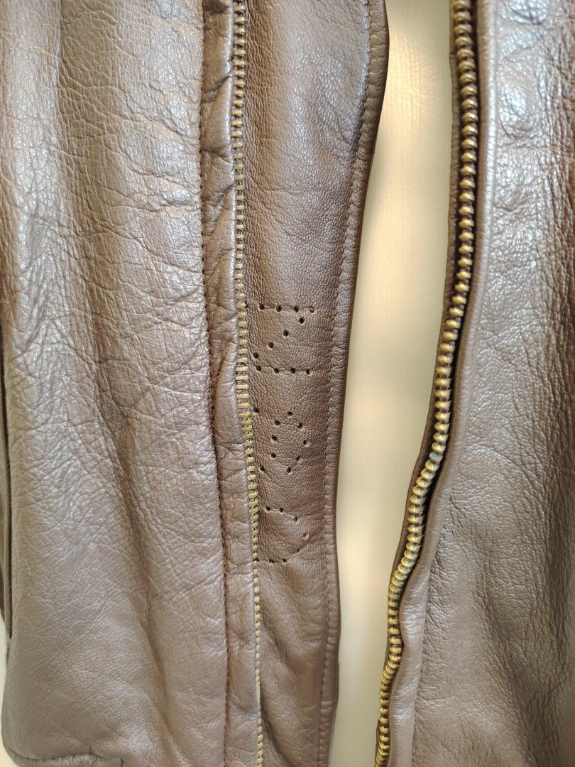 Vintage USN LEATHER JACKET (Category: Coats, Jackets and Outerwear) located in La Trinidad. Submitted by padasem_kadi (Listing ID 1469618784, Image 3). Description: - Style: Classic pilot flight bomber jacket - Color: Brown leather with a dark brown plush fur collar - Features: Front zip closure, dual button-flap waist pockets - Measurements (laid flat): Chest 23 inches, Length 26 inches, Sleeves 25.5 inches - Condition: Excellent buyer-friendly 