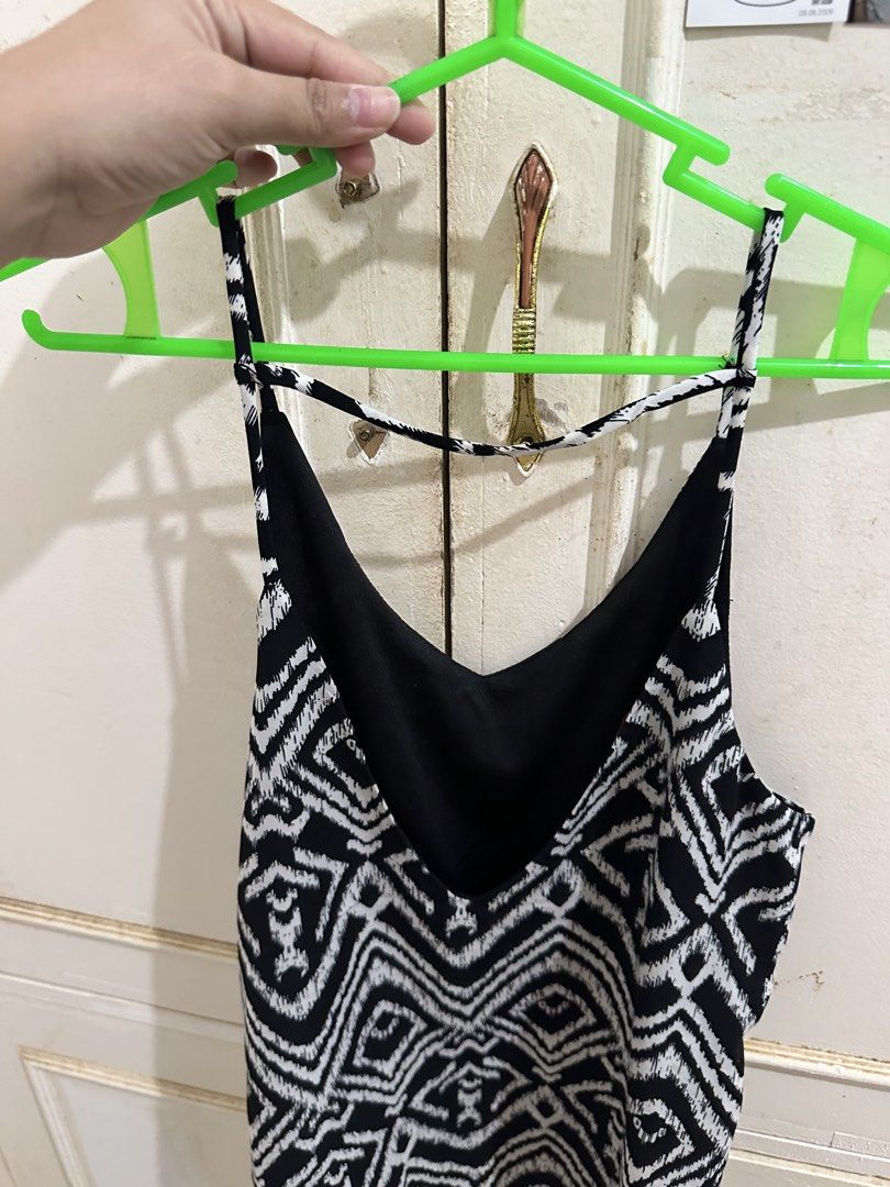 Vivace Black and White Patterned Camisole Top (Category: Sleeveless) located in Bugallon. Submitted by lavenderlane (Listing ID 1469708564, Image 2). Description: - Brand: Vivace - Design: Black and white pattern with V-neckline front and back - Straps: Thin spaghetti straps with a chic horizontal back strap detail - Fabric: Lightweight and breathable, perfect for warm weather or layering - Fit: Easy pullover design with no closures.