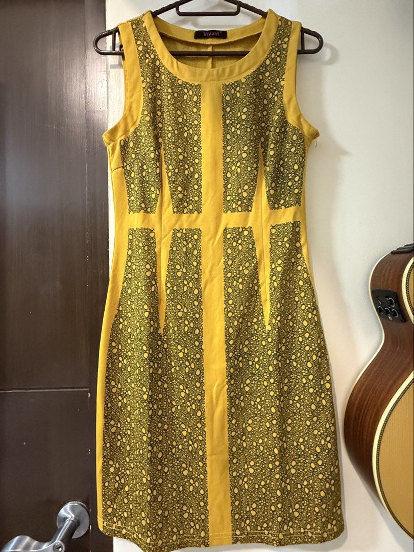 Vivant Yellow Patterned Sleeveless Dress Size S (Category: Dresses) located in Taguig. Submitted by decluttering_tita2 (Listing ID 1469691906, Image 1). Description: - Brand: Vivant - Size: S - Color: Bright yellow with contrasting dark lace-style vertical panels - Fit: Fitted silhouette with a scoop neckline - Closure: Easy-wear side zipper - Material: Smooth, comfortable fabric feel - Condition: Excellent.