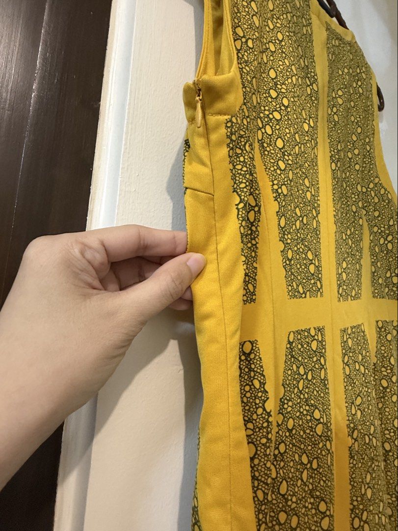 Vivant Yellow Patterned Sleeveless Dress Size S (Category: Dresses) located in Taguig. Submitted by decluttering_tita2 (Listing ID 1469691906, Image 3). Description: - Brand: Vivant - Size: S - Color: Bright yellow with contrasting dark lace-style vertical panels - Fit: Fitted silhouette with a scoop neckline - Closure: Easy-wear side zipper - Material: Smooth, comfortable fabric feel - Condition: Excellent.
