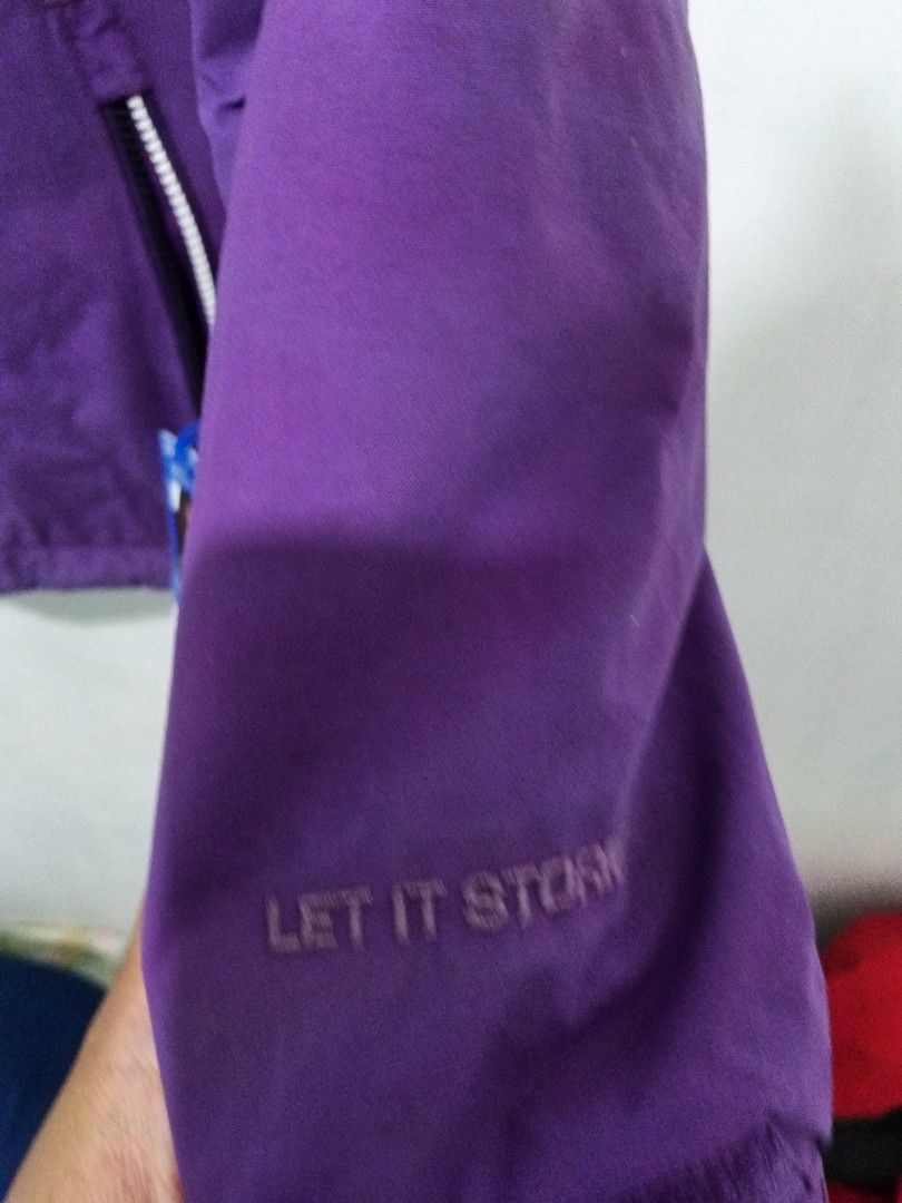 Volcom Purple Snowboard Winter Jacket (Category: Coats, Jackets and Outerwear) located in Abucay. Submitted by ukay_withdj (Listing ID 1469642157, Image 3). Description: - Brand: Volcom - Color: Solid Purple - Condition: Clean, no obvious flaws - Hooded design with front zipper and storm flap closure - Functional zippered lower left pocket with branded pull tab and pass tag - Long sleeves with adjustable velcro cuffs - Lightweight weather-resista