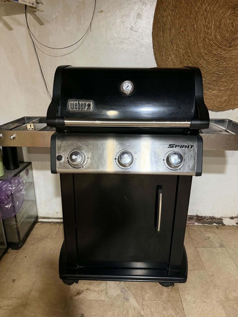 Weber grill (Category: Bathroom & Kitchen Fixtures) located in Manila. Submitted by yohjtorres (Listing ID 1469643000, Image 1). Description: 🔥 FOR SALE: ORIGINAL WEBER SPIRIT GAS GRILL 🔥 ✅ 3-burner gas grill ✅ All burners working ✅ With built-in temperature gauge ✅ Stainless-steel side tables ✅ With storage cabinet and wheels ✅ Ready to use Perfect for home BBQ, garden parties, and outdoor grilling!.