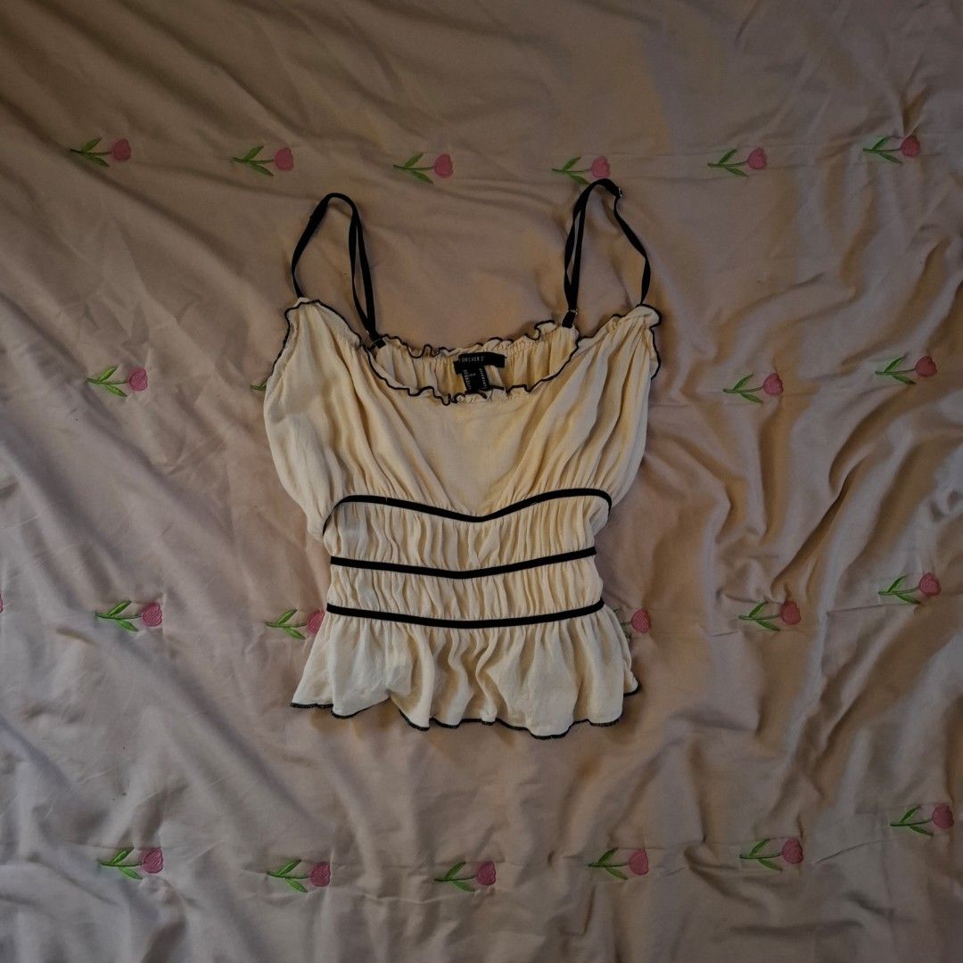 Westfade Orange Ruffle Crop Top (Category: Sleeveless) located in Dasmarinas. Submitted by luzella (Listing ID 1469726519, Image 3). Description: 100 EACH TOP - Condition: Brand new with tag still attached - Color: Vibrant orange - Design: Ruffle straps and gathered body - Fabric: Soft and comfortable - Versatility: Great basic piece, easy to match with high-waisted denim or skirts.