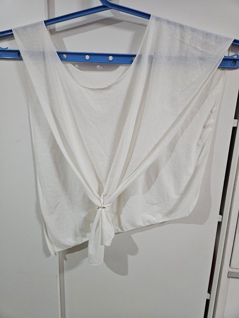 White Cape/Poncho asymmetrical sleeveless top (Category: Others Tops) located in Caloocan City. Submitted by rm.diaz (Listing ID 1469680276, Image 2). Description: - Color: Plain white - Style: Cape/Poncho-Style Top -Sleeveless with asymmetrical hem - Rounded boat neckline, open draped construction and a sharp slanted diagonal hemline - Fabric: Lightweight and breathable, ideal for covering a swimsuit .