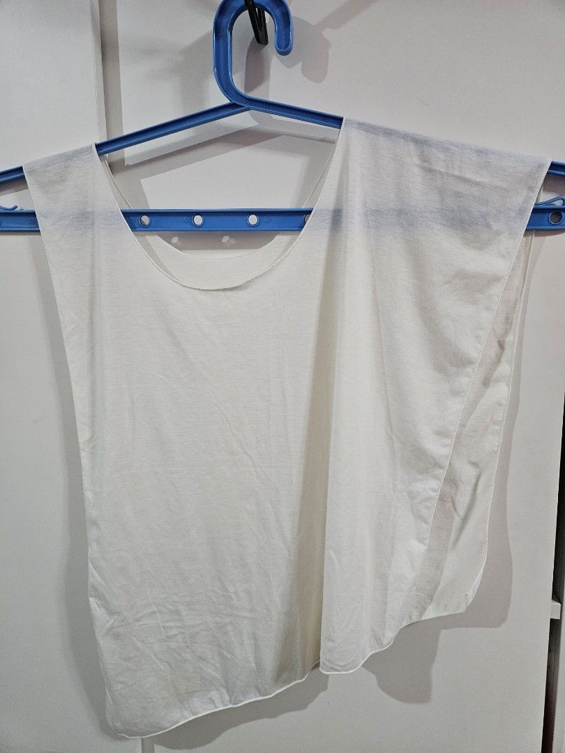 White Cape/Poncho asymmetrical sleeveless top (Category: Others Tops) located in Caloocan City. Submitted by rm.diaz (Listing ID 1469680276, Image 1). Description: - Color: Plain white - Style: Cape/Poncho-Style Top -Sleeveless with asymmetrical hem - Rounded boat neckline, open draped construction and a sharp slanted diagonal hemline - Fabric: Lightweight and breathable, ideal for covering a swimsuit .