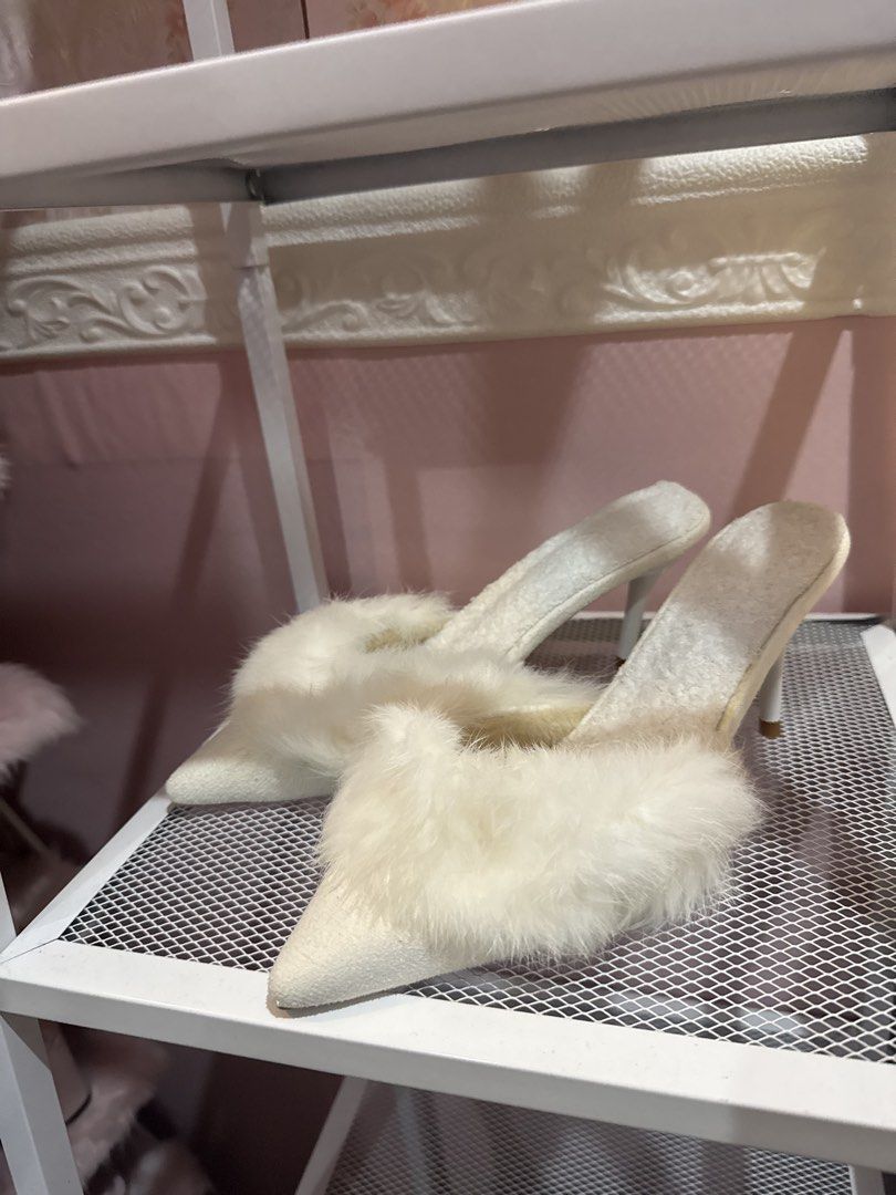 White Furry Pointed Toe Stiletto Mules Heels (Category: Heels) located in Bacoor. Submitted by micsr (Listing ID 1469640027, Image 3). Description: - Color: Clean white - Style: Pointed-toe slip-on mule with slim stiletto heels - Detail: Trendy fluffy faux fur trim across the front - Condition: Excellent, clean insoles and textured upper material - Occasion: Perfect for parties, night outs, or elevating casual outfits With flaws but brandnew neve