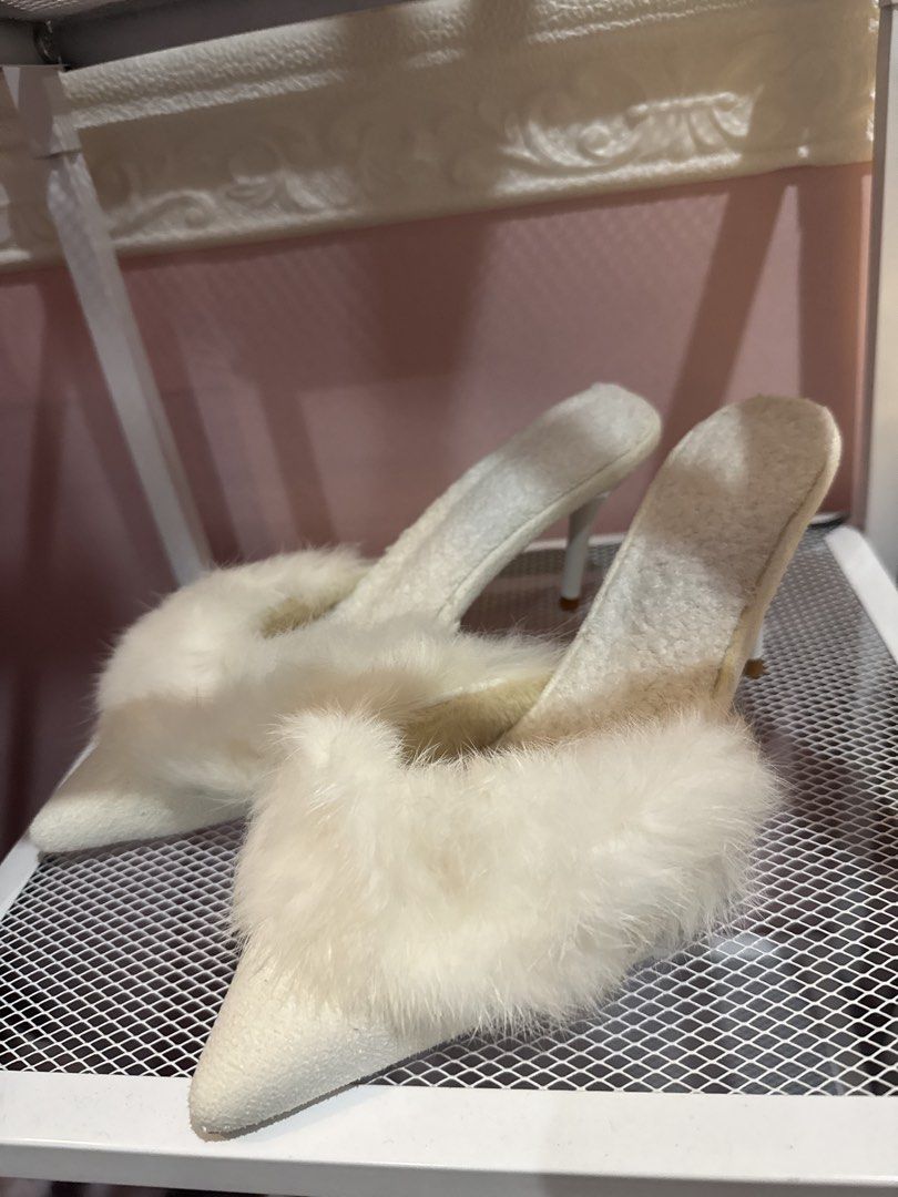 White Furry Pointed Toe Stiletto Mules Heels (Category: Heels) located in Bacoor. Submitted by micsr (Listing ID 1469640027, Image 2). Description: - Color: Clean white - Style: Pointed-toe slip-on mule with slim stiletto heels - Detail: Trendy fluffy faux fur trim across the front - Condition: Excellent, clean insoles and textured upper material - Occasion: Perfect for parties, night outs, or elevating casual outfits With flaws but brandnew neve