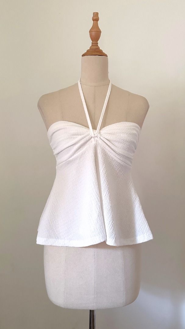 white halter top (Category: Sleeveless) located in Taguig. Submitted by esquepade (Listing ID 1469733045, Image 1). Description: size — small to medium bust: 34"-36" details — • crepe fabric • garterized.