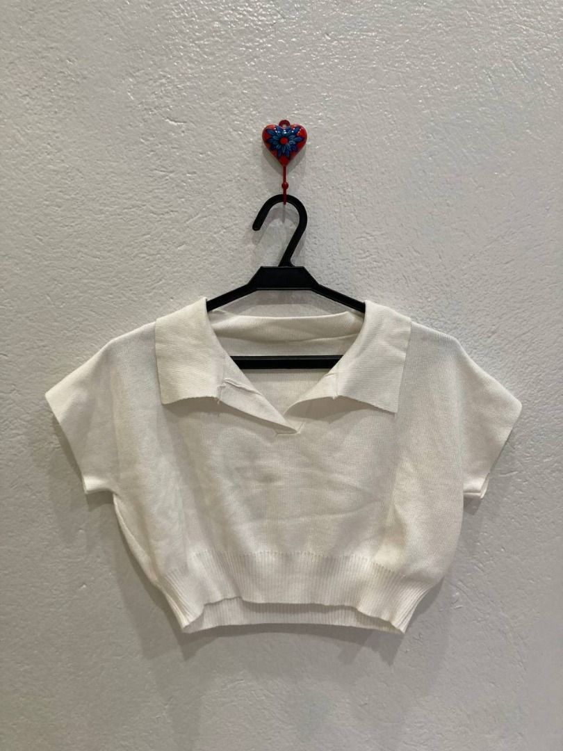 White Ribbed Crop Top with Polo Collar (Category: Sleeveless) located in Paranaque City. Submitted by choconika (Listing ID 1469712003, Image 1). Description: Price is negotiable just message. Measurements: *Material is flexible. Measurements are for reference. Length: 13.8 in. Raglan Sleeve: 12.1 in. Bust: 16.6 in. RFS: Decluttering MOP: GCash, PayMaya, BDO Courier: Grab, Lalamove.