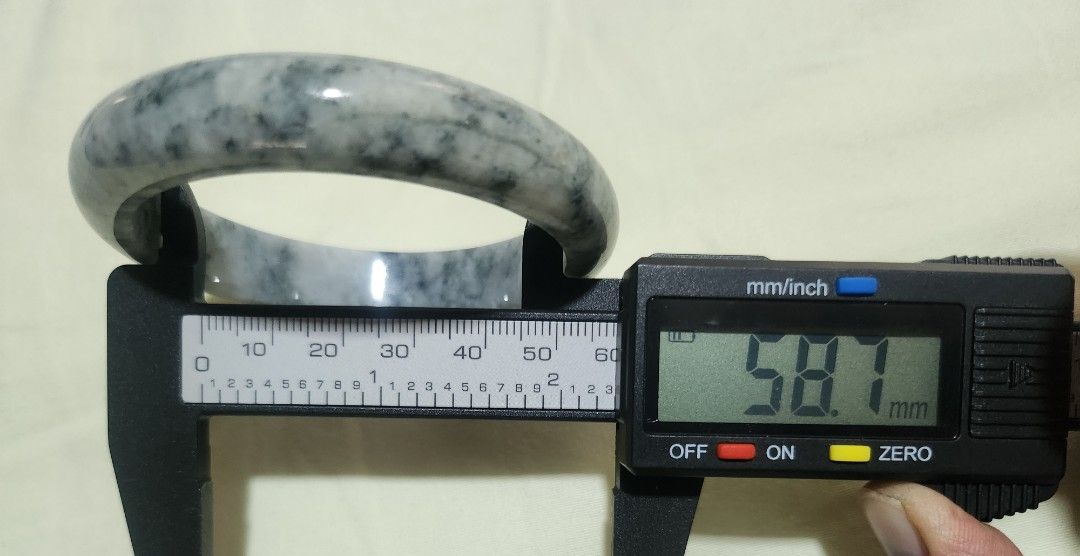 Wuji Burmese Jadeite Bangle 58.7mm (Category: Bracelets) located in Baguio. Submitted by lausgem2026 (Listing ID 1469638440, Image 3). Description: -Wuji Burmese Jadeite Bangle -Grade A (natural and untreated). -58.7mm diameter size. 12.8mm thickness. -Note: Has natural stonelines but none that can be touched externally. -Comes with free box but no certificate. -Location: Baguio City.